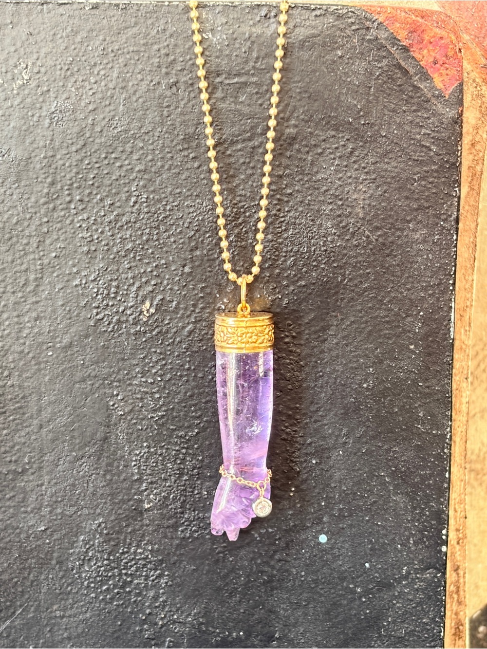 Carved Amethyst Mano Pendant with Gold Cap